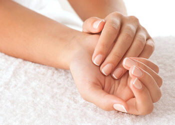 Beautiful hands on the white towel